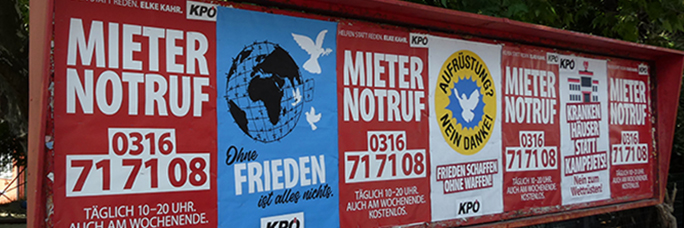 Posterreihe der KPÖ vor dem Volkshaus in Graz, Mai 2025 / © Pit Wuhrer Posterreihe der KPÖ vor dem Volkshaus in Graz, Mai 2025 / © Pit Wuhrer